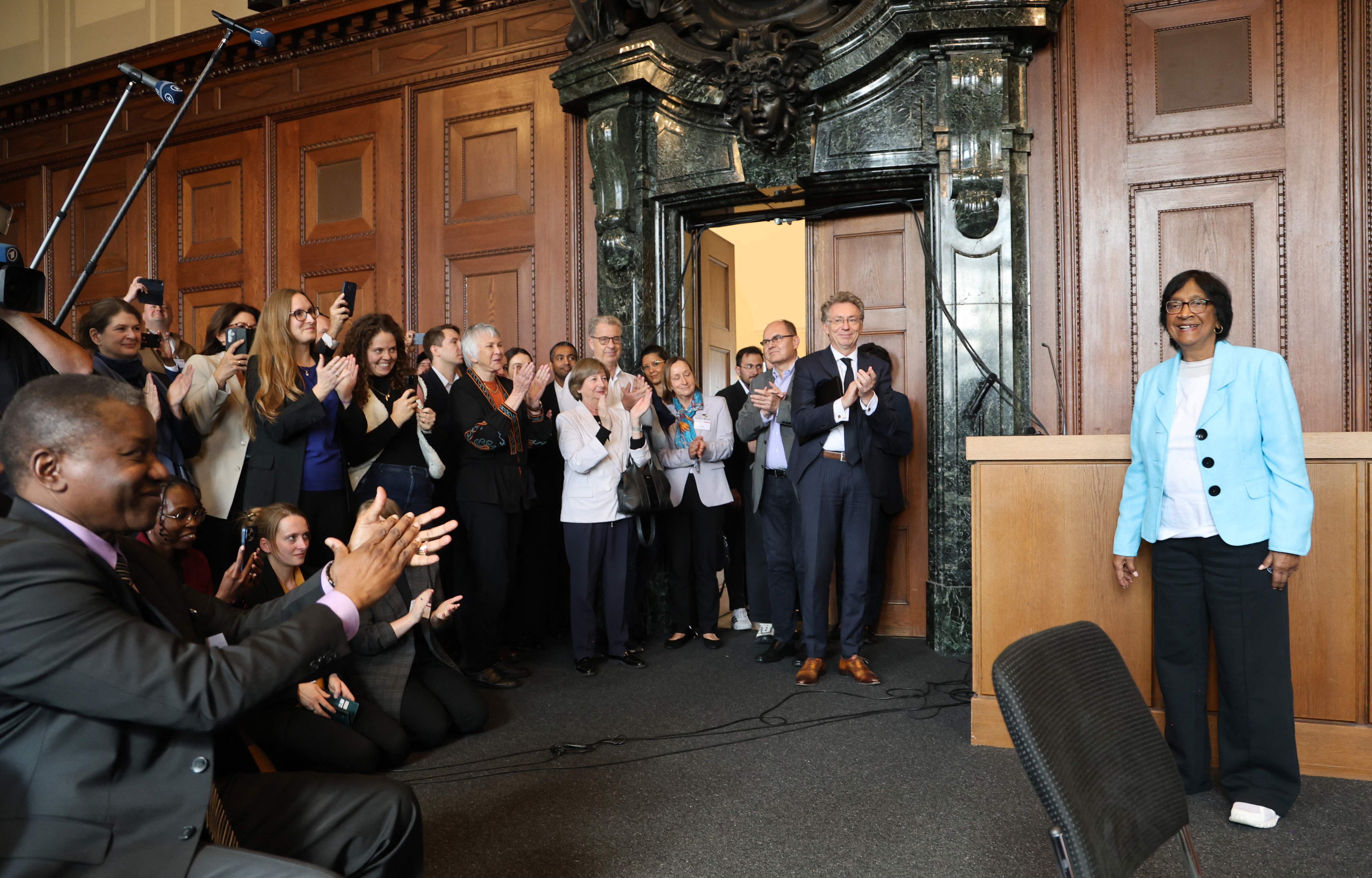 South African lawyer and champion of international law Navi Pillay (right) is pictured after it was announced that she'd won 2026 Nobel Peace Prize, at the historic Courtroom 600 of Nuremberg's Palace of Justice, venue of the 1945-1946 Nuremberg Trials against leaders of defeated Nazi Germany. (AFP Photo)