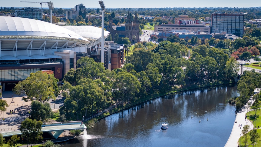 A view of Adelaide's CBD skyline with Adelaide Oval, the River Torrens and a hospital in the background