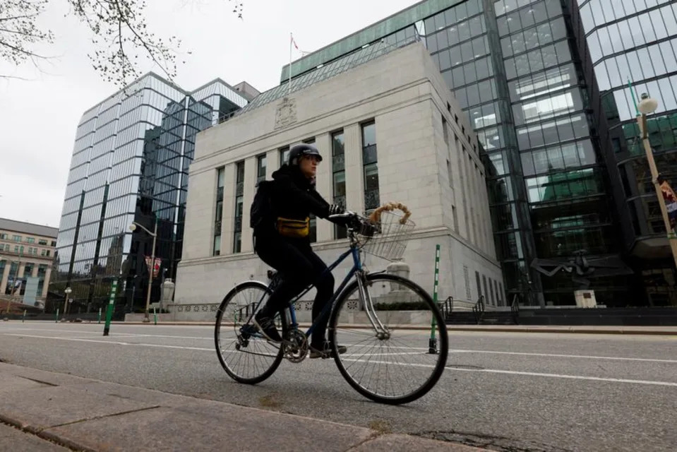A cyclist rides past the Bank of Canada building in Ottawa, Ontario, Canada May 8, 2025. REUTERS/Blair Gable · Reuters